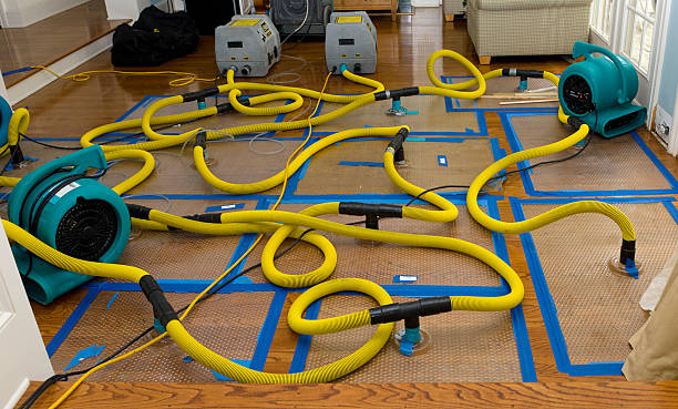 Professional Flood Damage Restoration technician working in North Monmouth, ME